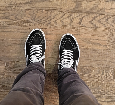 Vans on wooden surface